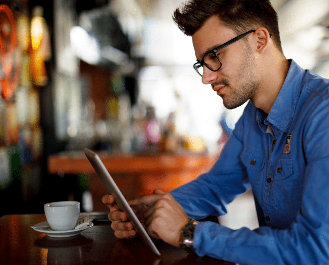 man on computer setting up Grubhub Direct