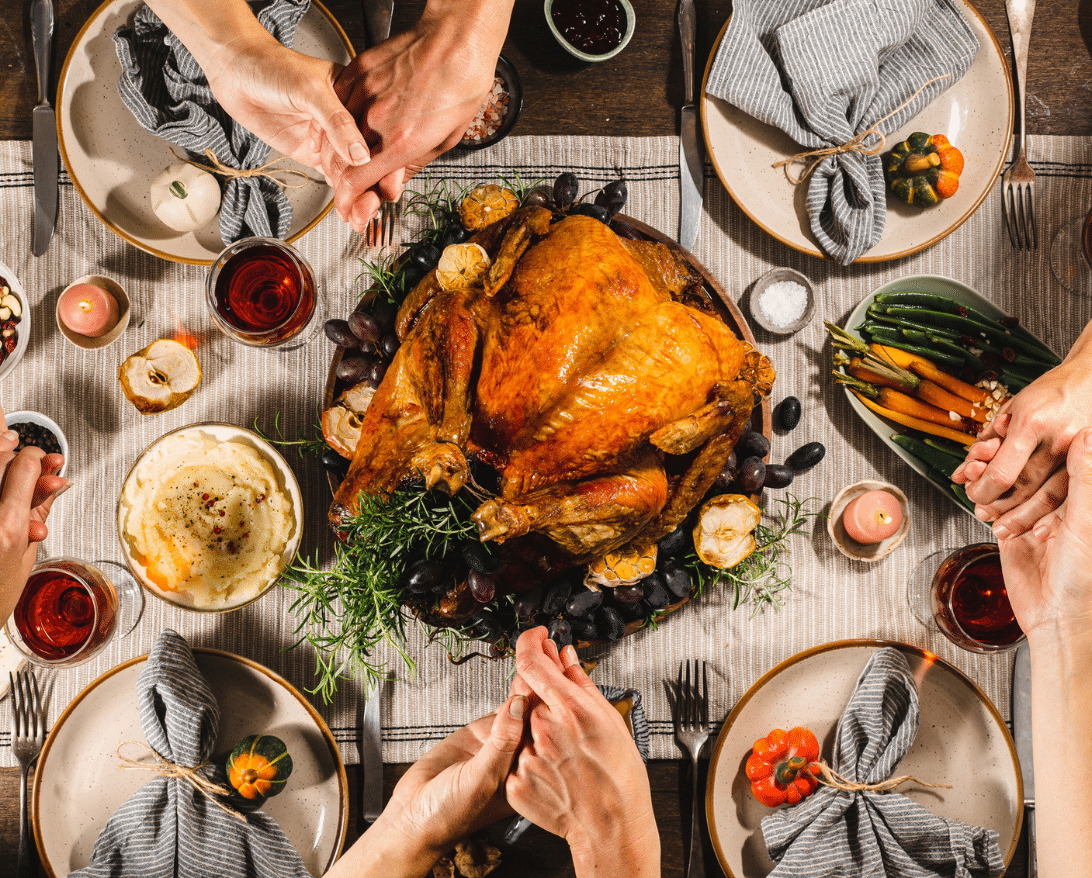 Family eats Thanksgiving dinner