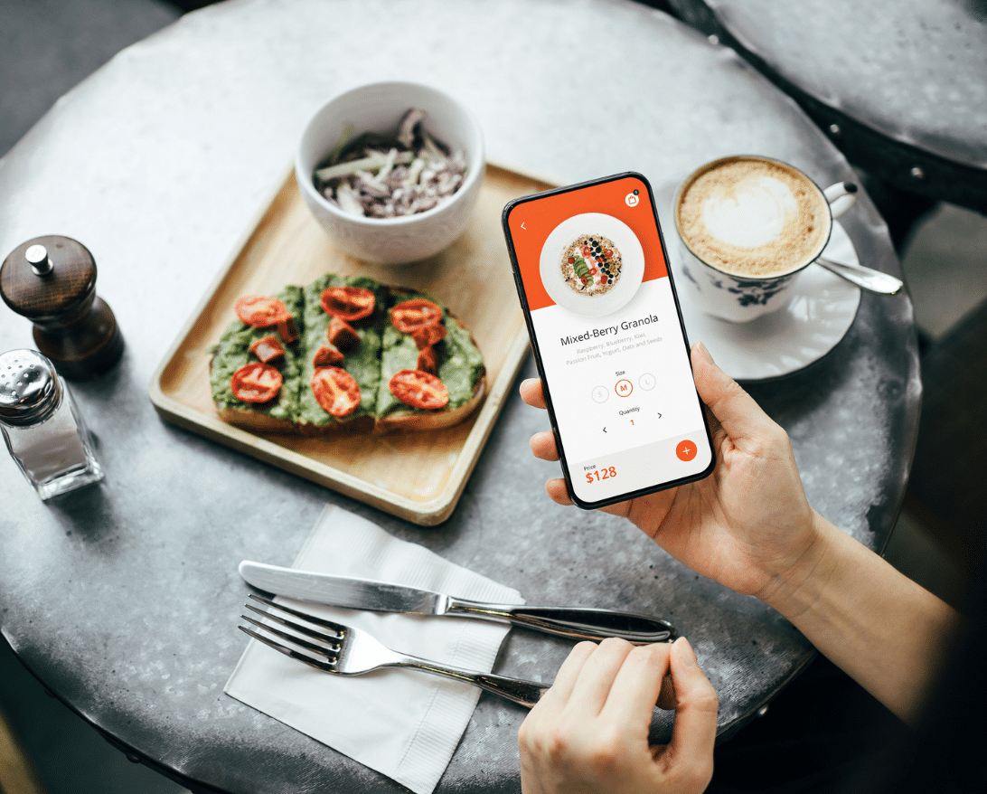 A woman uses her phone following restaurant tips