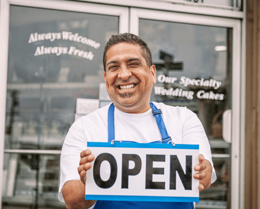 A restaurant owner stands in front of a restaurant he bought