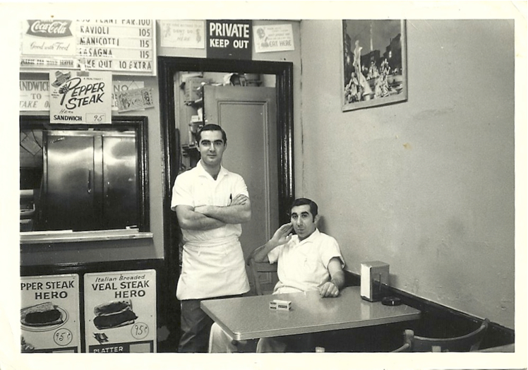 Two men inside Rudy's restaurant